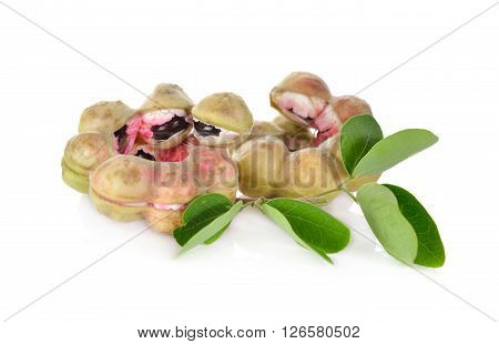 manila tamarind fruit with leaf on white background