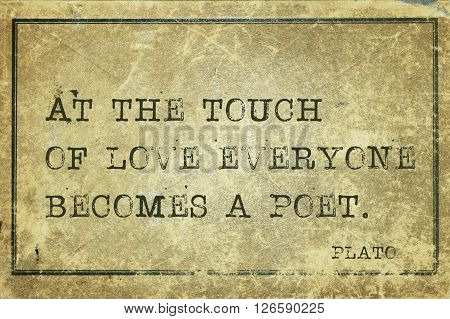 At the touch of love everyone becomes a poet - ancient Greek philosopher Plato quote printed on grunge vintage cardboard