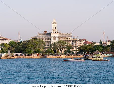STONE TOWN ZANZIBAR - MARCH 29 2016: Stone Town on Zanzibar with House of Wonders seen from the ferry from Dar es Salaam.