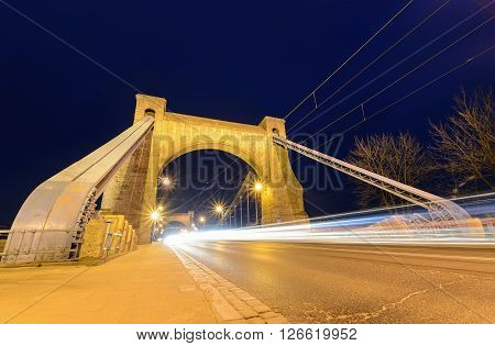 Wroclaw most famous bridge at dusk - with white auto trails. Grunwaldzki Bridge. Poland.