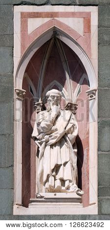 FLORENCE, ITALY - JUNE 05: Il Pensatore (The Thinker) by Donatello, Campanile (Bell Tower) of Cattedrale di Santa Maria del Fiore, Florence, Italy on June 05, 2015