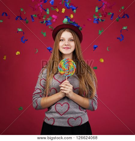 Beautiful Girl Wearing Hat Holding Big Striped Lollipop