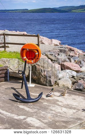Anchor on the Pier in Loch Ness in Scotland. Loch Ness is a city in the Highlands in Scotland in the United Kingdom.