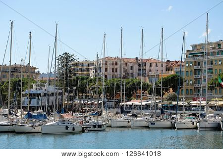 Monte Carlo Monaco - September 21 2015: luxury sailing boats yachts at moorage in sea port inshore on summer day on cityscape background