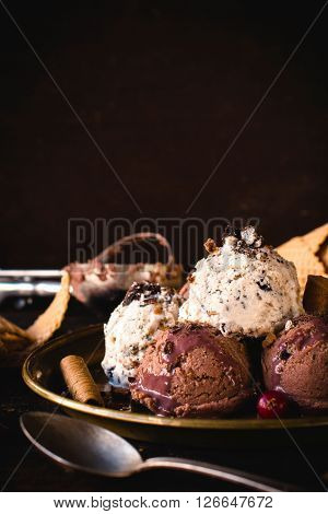 Stracciatella and chocolate ice cream in the plateselective focus and blank space