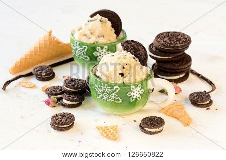 Vanilla ice cream with cookies in the cups selective focus