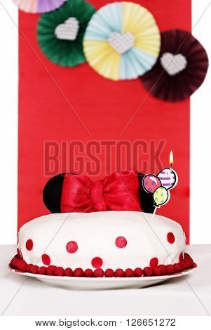 Mastic Cake decorated with ears of Minnie Mouse and a bow
