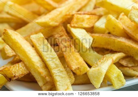 Hot fresh French fries snack in the plate