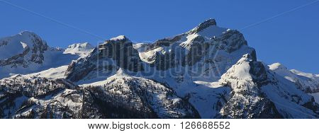 Snow covered mountain Schlauchhorn. Beautiful mountain range near Gstaad, Swiss Alps. View from Feutersoey.