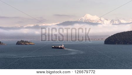 An Oil Tanker makes it way towards the sea from Anacortes WA