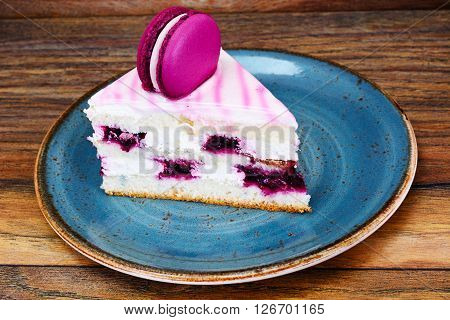 Sweet and Colourful Cake with French Macaroons. Studio Photo