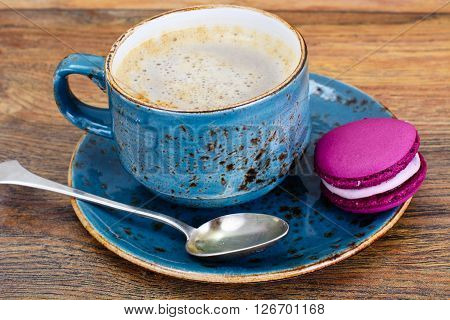 Sweet  French Macaroons with Cofee Cup. Studio Photo