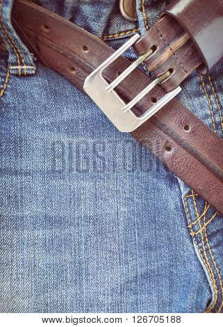 blue jeans with brown leather belt for design