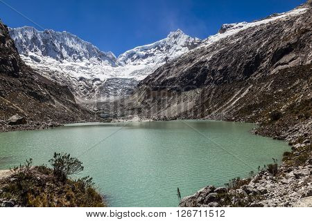 Llaca lagoon (4474 m) in the peruvian Andes and Ocshapalpa peak (5888 m) and Ranrapalca peak (6162 m) Peru