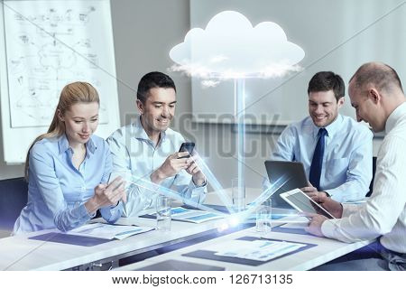business, people, cloud computing and technology concept - smiling business team with smartphones, tablet pc computers working in office