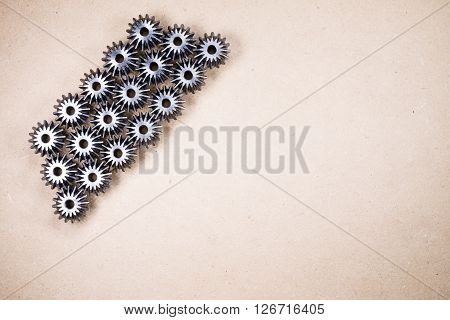 Mechanical components on wooden background. Gears industrial objects
