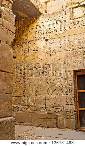 The wall in Khonsu Temple decorated with the reliefs depicting the God of Moon Khons Karnak Complex Luxor Egypt.