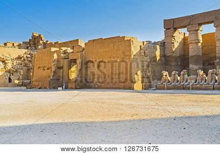LUXOR EGYPT - OCTOBER 7 2014: Two stone statues in front of the entrance of the Temple of Ramesses III located in Karnak Complex on October 7 in Luxor.