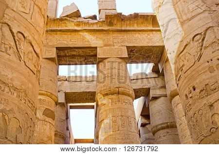 The numerous columns of the Hypostyle Hall are fine examples of the ancient Egyptian art Karnak Temple Luxor Egypt.