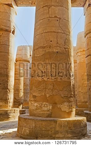 The columns of Hypostyle Hall contain hieroglyphic inscriptions and pictures made in honor of Seti I and his descendants Karnak Temple Luxor Egypt.