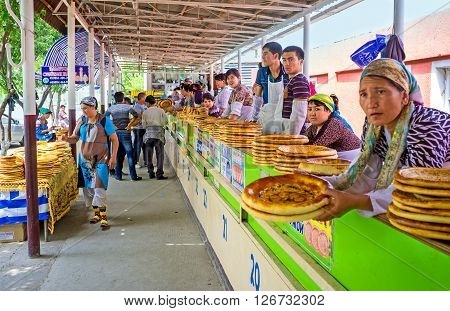 PUNGAN UZBEKISTAN - MAY 6 2015: The rustic food market specializes exclusively in bakery products on May 6 in Pungan.