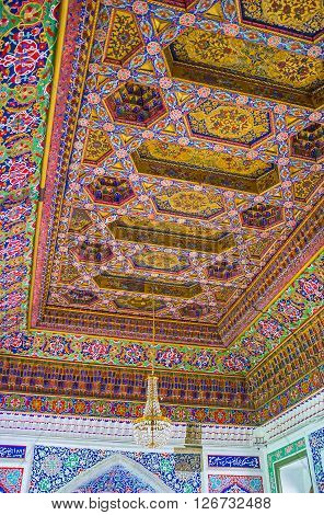 KOKAND UZBEKISTAN - MAY 6 2015: The ceiling in the Great Throne Room of Khudayar Khan Palace decorated in brown color gamma with fine patterns on May 6 in Kokand.