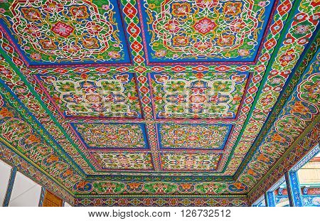 KOKAND UZBEKISTAN - MAY 6 2015: The decorations of the Khudayar Khan Palace are the mix of islamic and oriental art including carvings paintings and glazed tiles on May 6 in Kokand.