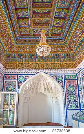 KOKAND UZBEKISTAN - MAY 6 2015: The Small Throne Room of Khudayar Khan Palace with richly decorated ceiling and walls on May 6 in Kokand.