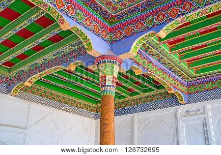 KOKAND UZBEKISTAN - MAY 6 2015: The old traditional roof decoration of the tiny Iwan in Damoi Shakhon Shrine on May 6 in Kokand.