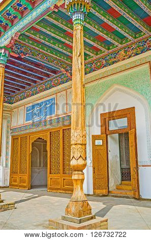KOKAND UZBEKISTAN - MAY 6 2015: The carved wooden door leads from the courtyard to the Throne rooms of Khudayar Khan Palace on May 6 in Kokand.