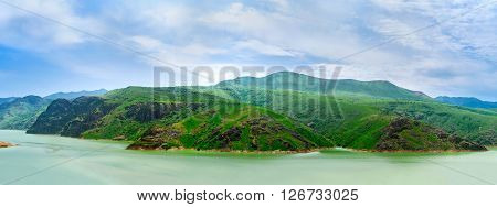 Panorama of the slopes of Qurama mountains and the Achangaran reservoir on the foreground Uzbekistan.