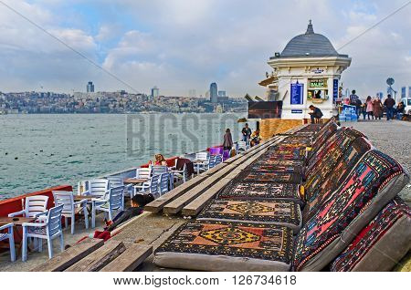 ISTANBUL TURKEY - JANUARY 21 2015: The traditional Turkish lounges in the outdoor teahouse located on Uskudar embankment on January 21 in Istanbul.