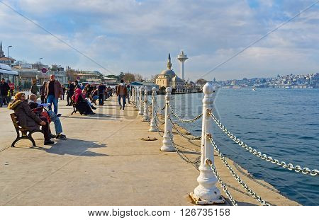 ISTANBUL TURKEY - JANUARY 21 2015: The Uskudar embankment located on the Asian shore of the Bosphorus and it's popular place among the tourists and locals on January 21 in Istanbul.
