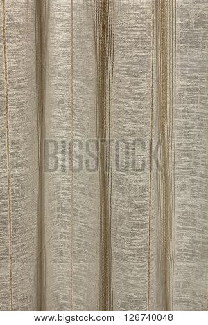 A background thread rolling curtain in vertical composition.