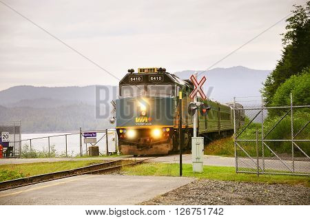 Prince Rupert Canada - June 26 2011: Passenger train to Prince George approach to the platform by the port at early morning time.