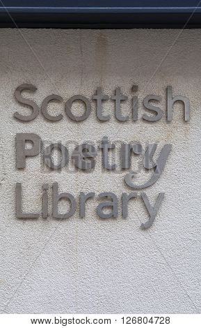 EDINBURGH SCOTLAND - MARCH 8TH 2016: The sign on the exterior of the Scottish Poetry Library located in Crichtons Close off of The Royal Mile in Edinburgh on 8th March 2016.