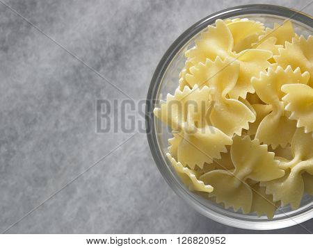 dry farfalloni pasta on the marble top