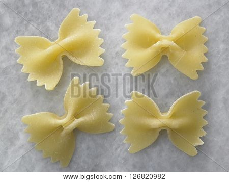 dry farfalloni pasta on the marble top