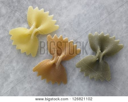 dry farfalloni pasta on the marble top