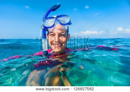 Joyful girl in yellow mask going scuba diving.