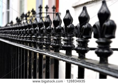 Fleur de lis railing outside victorian houses