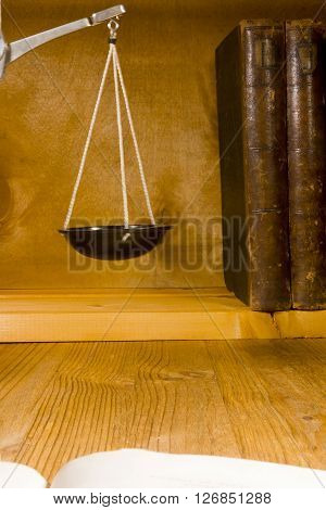 Vintage pharmacy tools  scales and books on a wooden background
