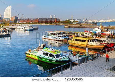 YOKOHAMA JAPAN - NOVEMBER 24 2015: Yokohama Port has 10 major piers. In 2013 the Port served 37706 ships. It handled 271276977 tons of cargo and 2888220 TEU containers