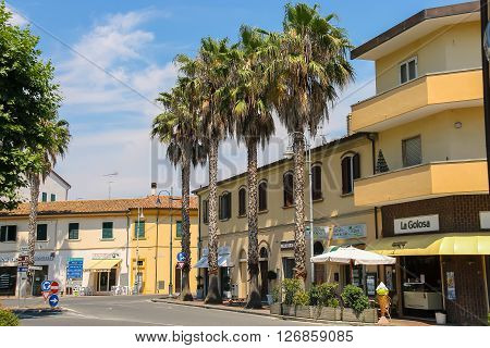 Vada Italy - June 29 2015: Vada Italy - June 29 2015: Buildings on Piazza Garibaldi in small town Vada on the coast of the Ligurian Sea. Province Livorno Tuscany region of Italy