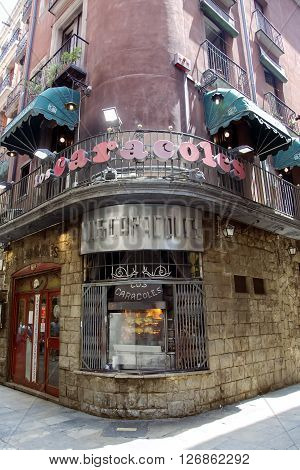 SPAIN, BARCELONA, JUNE, 27, 2015 - Los Caracoles, a typical and traditional restaurant in Barcelona's Gothic Quarter. The menu is based on the classic recipes of the Catalan and Mediterranean cuisine and snails in sauce are, of course, the house's special