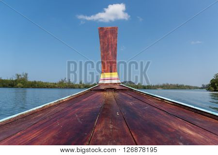 Thai Wooden Head Longtail Boat Heads Toward