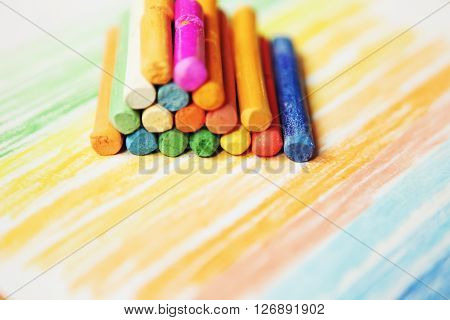 The colored dry postels close up background.