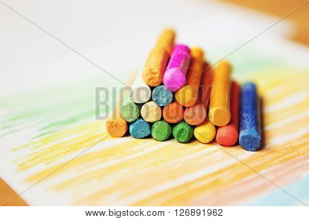 The colored dry postels close up background.
