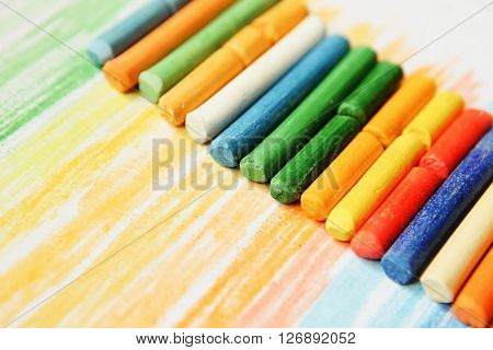 The colored dry postels close up background.