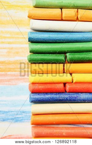 The colored dry postels close up background.